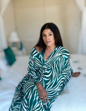 Seen here:  Gorgeous Kaftan crafted from the softest viscose with eye-catching green animal print, this stunning boho chic kaftan will turn some heads!! Wear it while lounging at the pool or at home. 